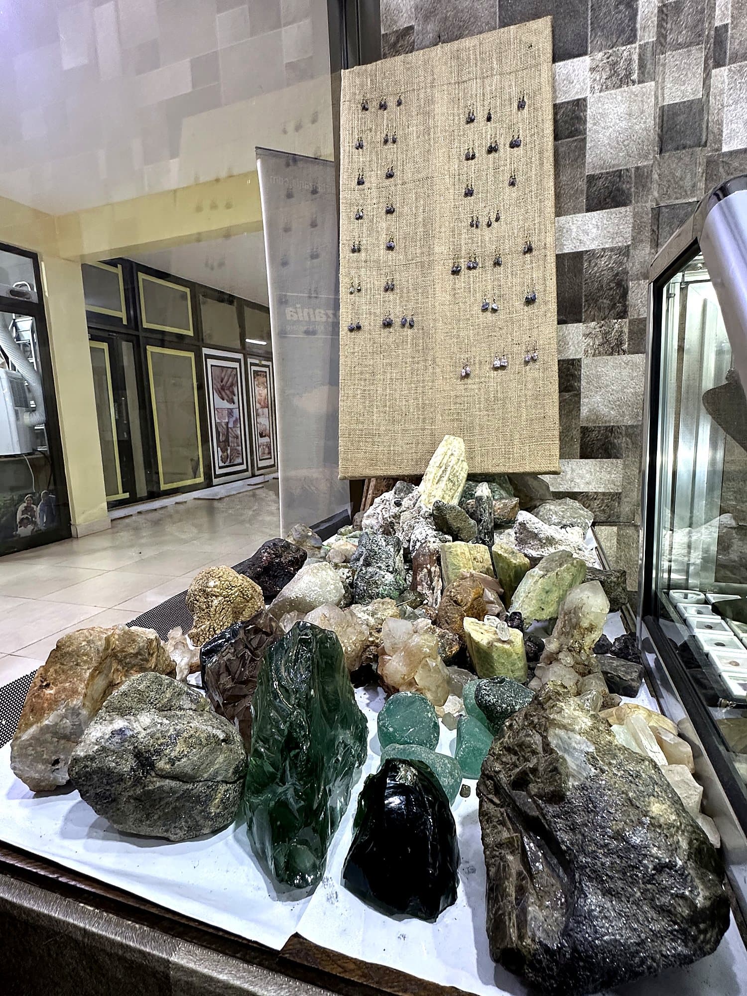 Rough gemstone specimens on display in the showroom
